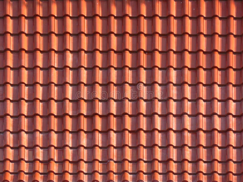 Roofing texture. Red corrugated tile element of roof.