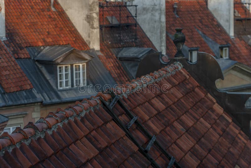 Red tile roofs of Old Town Warsaw with old ladder. Red tile roofs of Old Town Warsaw with old ladder