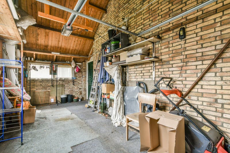 A Room with Brick Walls and a Garage with Boxes Editorial Photo Image