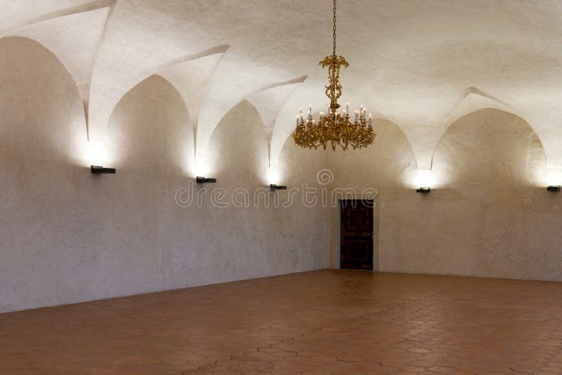 Room in the castle with a gold chandelier