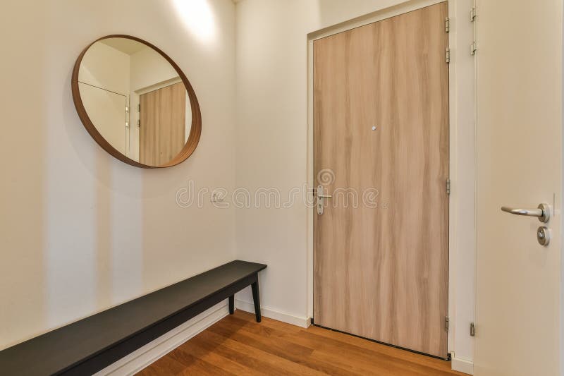 A Room with a Door and a Mirror and a Stock Photo Image of hallway