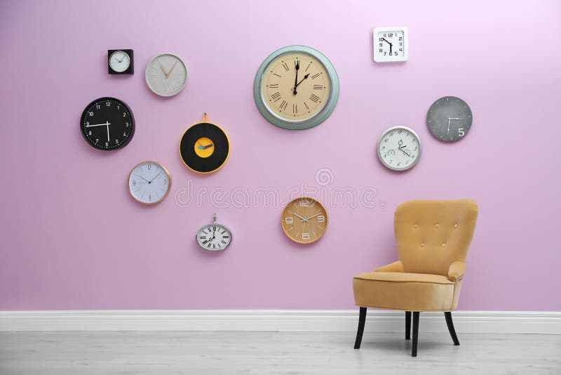 Room Interior with Many Different Clocks on Wall. Stock Image Image