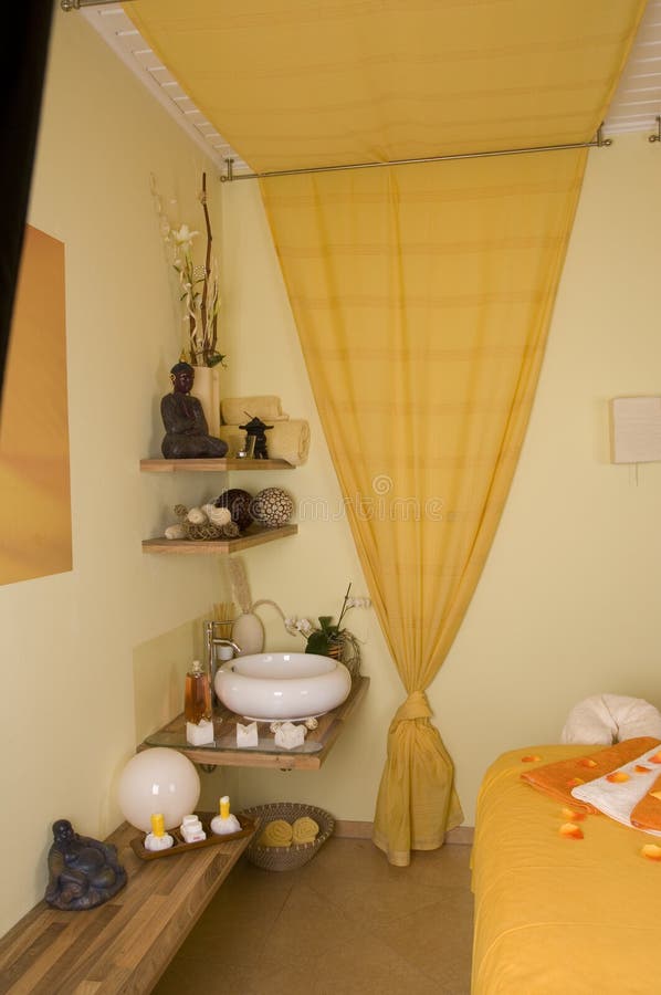 Inside a spa room with a lot of essential utensils as a wide angle image. Inside a spa room with a lot of essential utensils as a wide angle image