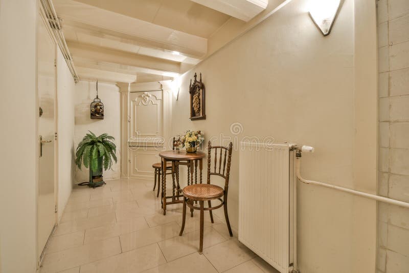A Room with a Table and Chairs in the Hallway Stock Image Image of