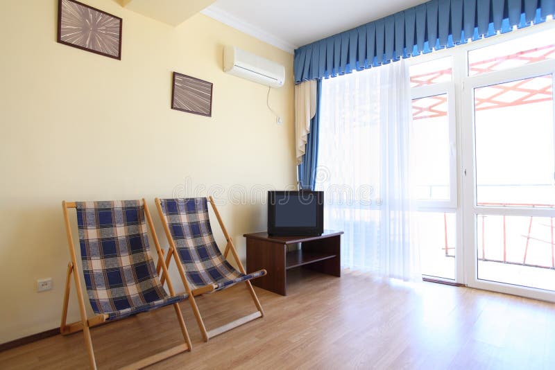 Room with Two Chaise Lounges and TV Stock Image Image of solitude