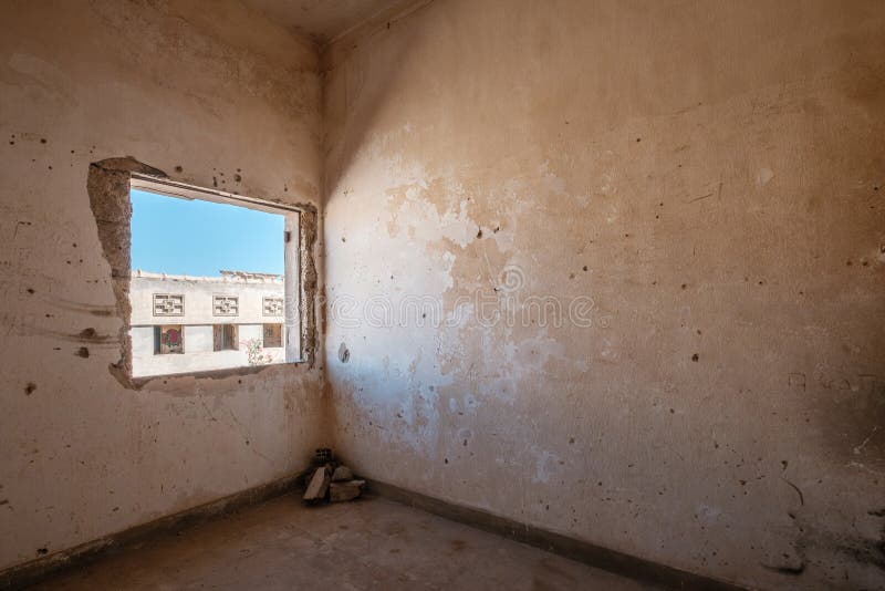 Room and window inside abandoned building , run down flat stock image