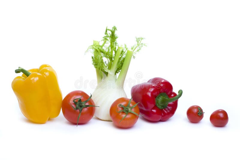 Root of parsley of red pepper with yellow pepper and tomatoes on