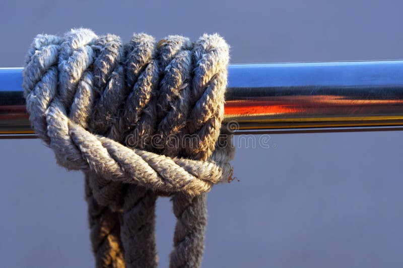 Rope knot tied to railing stock image. Image of tackle 223847263