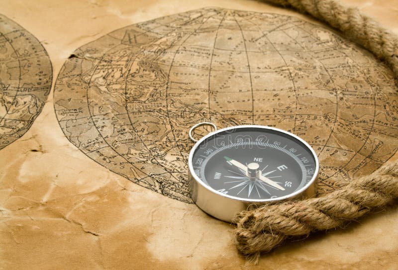 Compass and Chess on old map Stock Photo by ©kwanchaidp