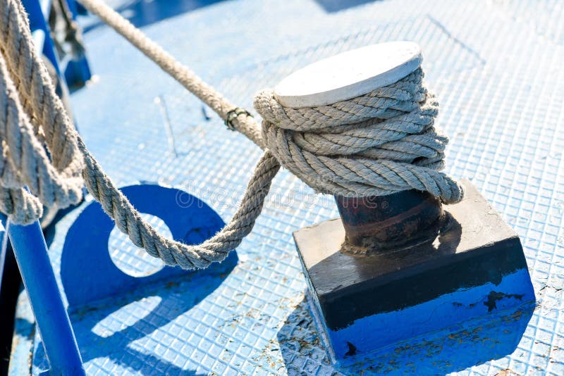 Rope tied to steel bollard stock photo. Image of nautical - 83767526