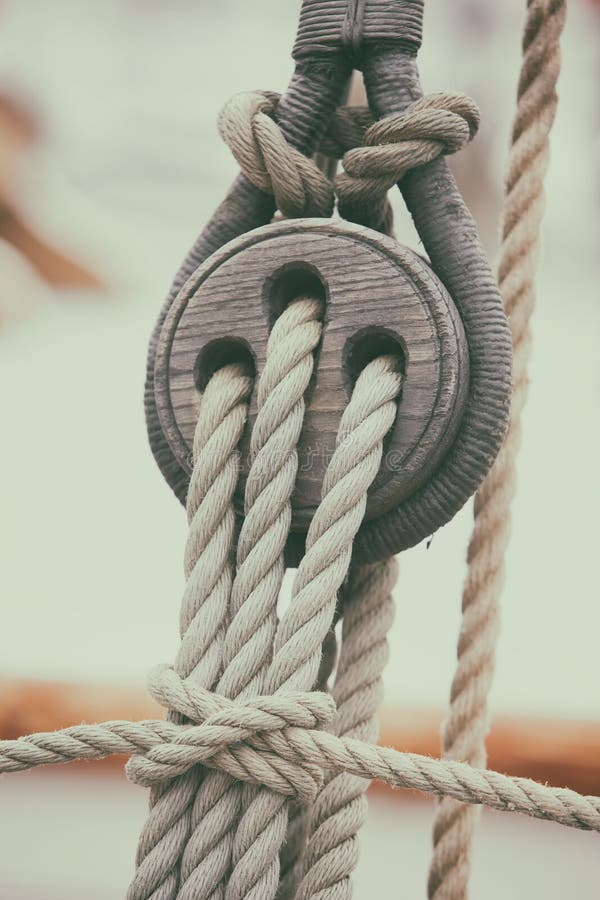 Ropes tied in knots and units associated with rigging on a sailboat. Ropes tied in knots and units associated with rigging on a sailboat