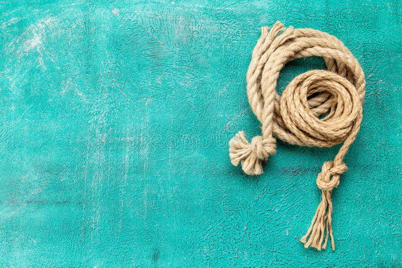 Ropes tied with knots on turquoise background