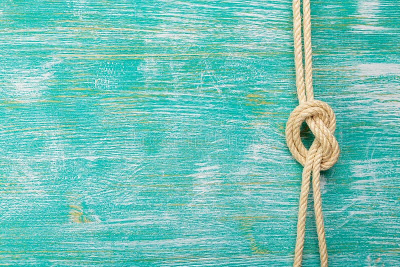 Ropes tied with knots on turquoise background