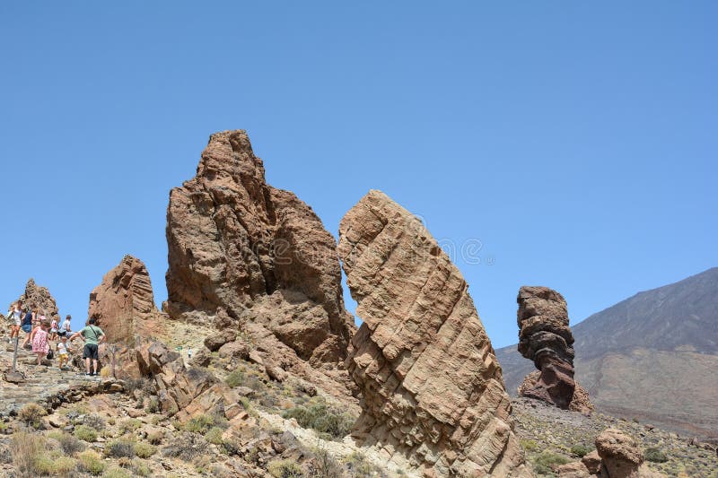 The bizarrely shaped Roque Cinchado rock of volcanic rock in Teide National Park on the Canary Island of Tenerife, Spain. The bizarrely shaped Roque Cinchado rock of volcanic rock in Teide National Park on the Canary Island of Tenerife, Spain