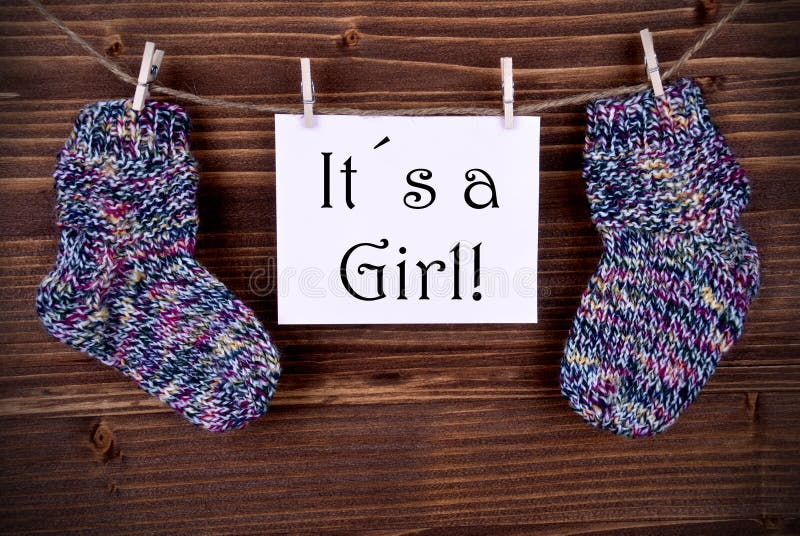 Rosa färger märker med behandla som ett barn sockor och dess en flicka royaltyfri bild Rosa färger märker med behandla som ett barn sockor och dess en flicka royaltyfri bild