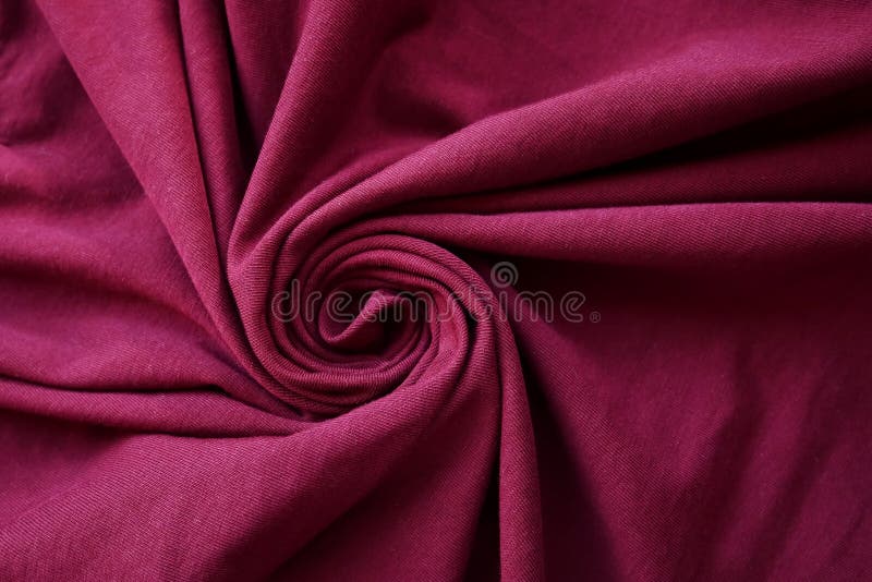 Rosa kläder röra sig i spiral formtextilbakgrund som är falsk upp design arkivbilder Rosa kläder röra sig i spiral formtextilbakgrund som är falsk upp design arkivbilder