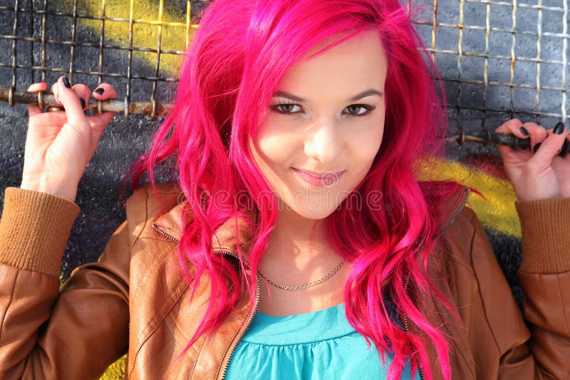 Young and pretty woman with pink hair. Young and pretty woman with pink hair