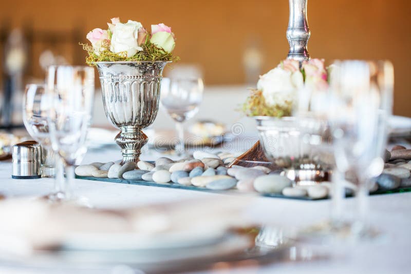 Rose bouquet in silver vase at wedding reception royalty free stock photo Rose bouquet in silver vase at wedding reception royalty free stock photo