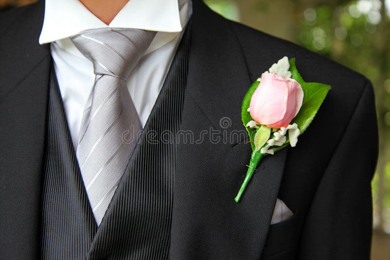 Wedding suit with tie and rose buttonhole. Wedding suit with tie and rose buttonhole