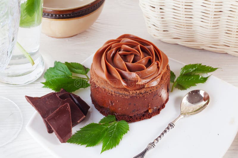 Rose chocolate mousse cake on a beautiful plate cream