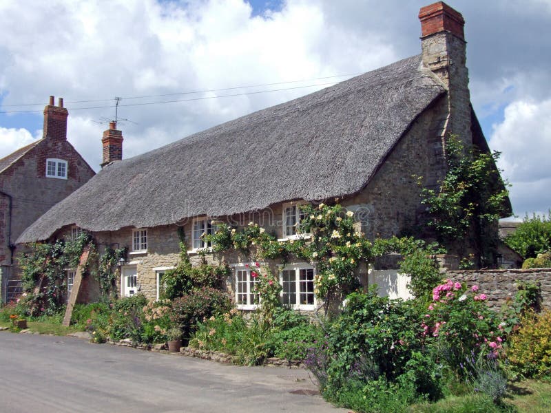 Rose covered thatched cottage