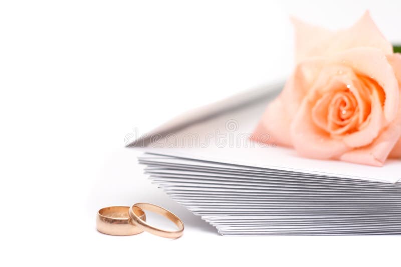 Rose, envelopes and wedding rings