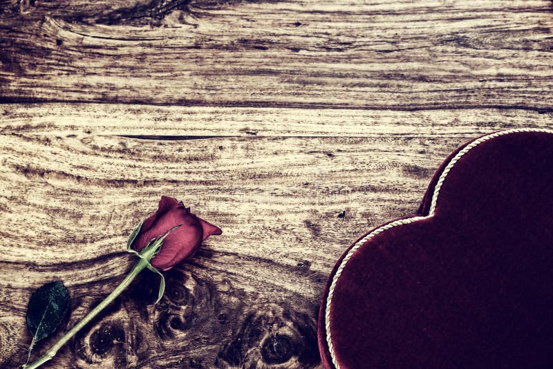 Rose and Heart Shaped Box on Rustic Wood