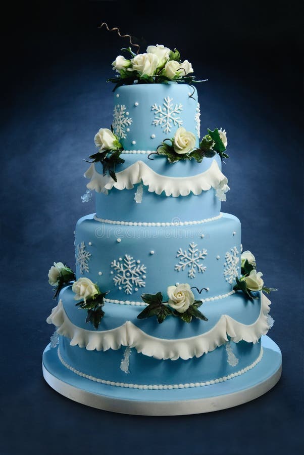 Rose wedding cake. Romantic blue wedding cake decorated with hand made frosted sugar roses, snow cristals and sugar cristals Rose wedding cake. Romantic blue wedding cake decorated with hand made frosted sugar roses, snow cristals and sugar cristals