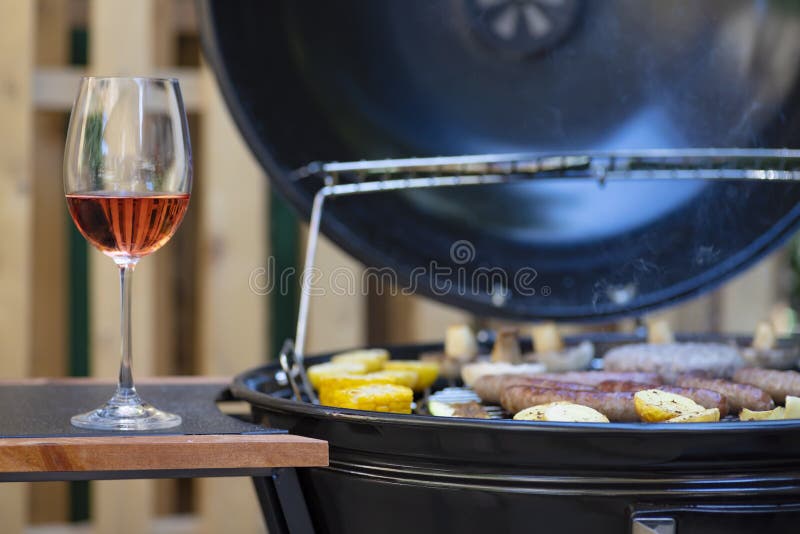 Rose wine and garden grill stock photo. Image of drink 207673516