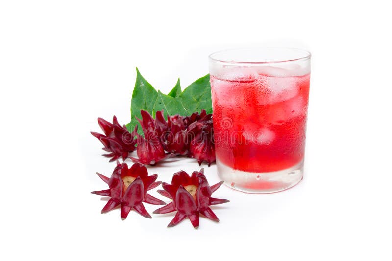 Roselle juice healthy drink in glass with ice and dried roselle fruit flowers