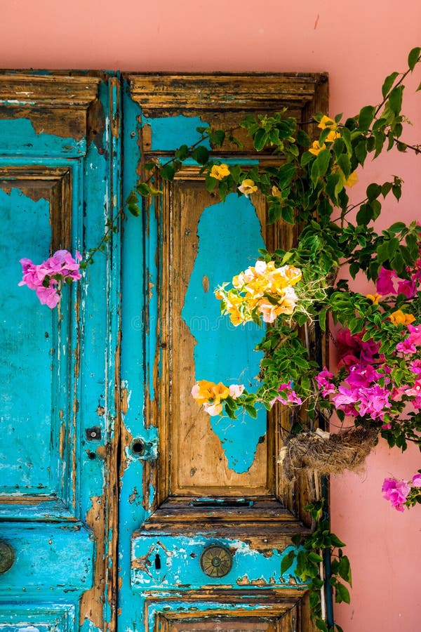 Peeling paintwork on an old door in Katakolon, Greece.