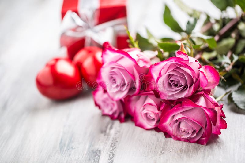 Roses. Pink Roses with Two Hearts and Red Gift Stock Image - Image of ...