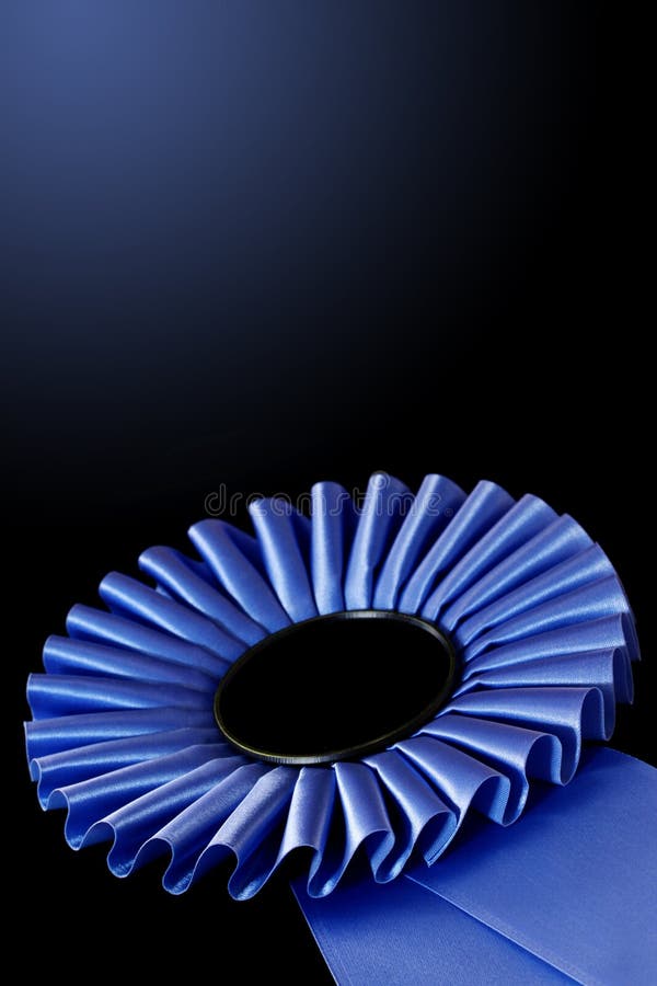 Blue rosette, over black background. Shallow DOF, lots of copy space. Blue rosette, over black background. Shallow DOF, lots of copy space.