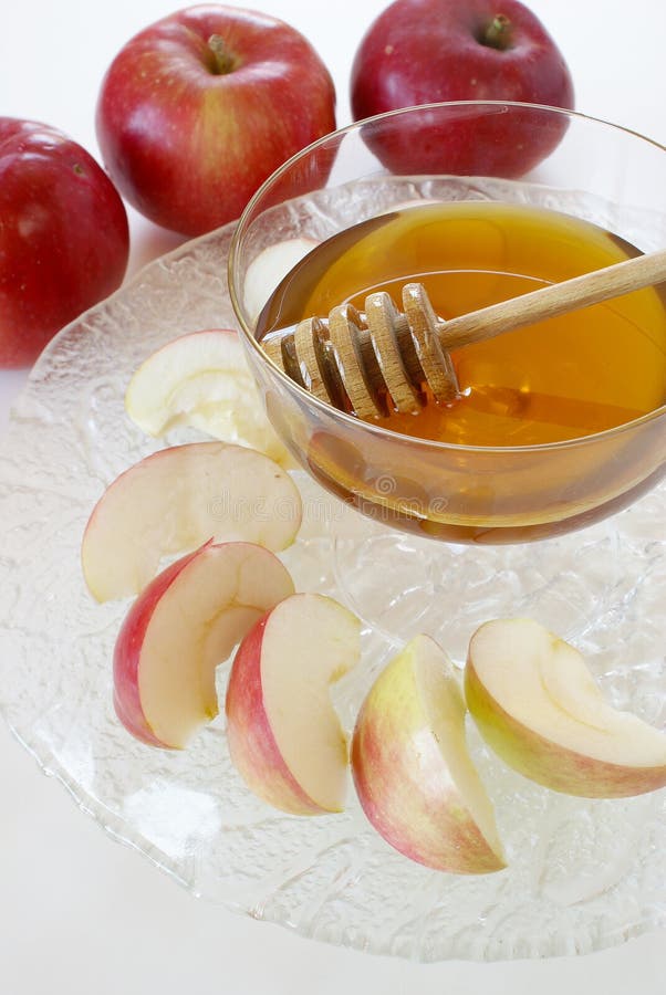 Honey with honey dipper and apples - traditional food for Jewish New Year. Kosher stock images, royalty-free photos and pictures