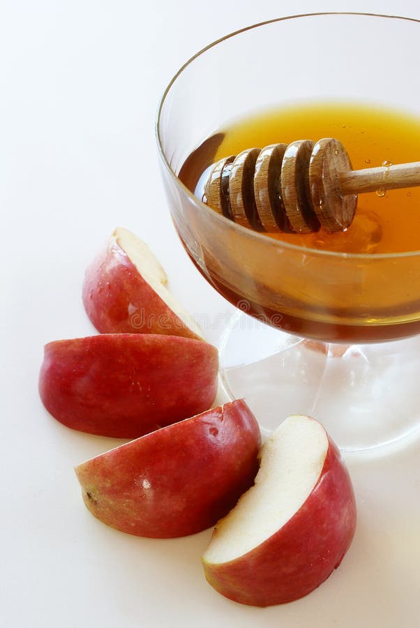 Honey with honey dipper and apples - traditional food for Jewish New Year. Kosher stock images, royalty-free photos and pictures