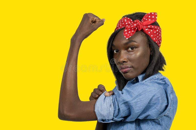 Beautiful woman dressed as the iconic Rosie the Riveter. Beautiful woman dressed as the iconic Rosie the Riveter