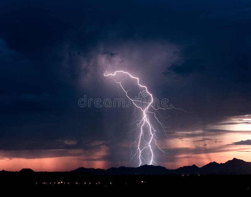 Lightning strikes the Roskruge Mountains just after sunset. Lightning thunder stock images, royalty-free photos and pictures