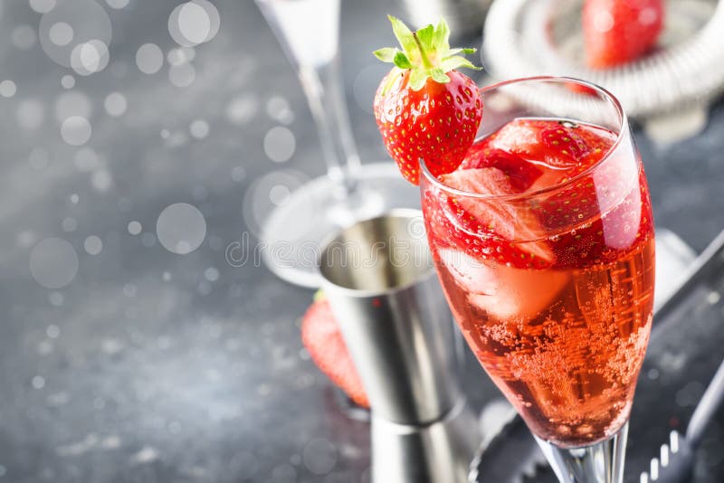 Rossini alcoholic cocktail with Italian sparkling wine, strawberry puree and ice in champagne glasses, place for text, selective. Focus royalty free stock photo Rossini alcoholic cocktail with Italian sparkling wine, strawberry puree and ice in champagne glasses, place for text, selective. Focus royalty free stock photo