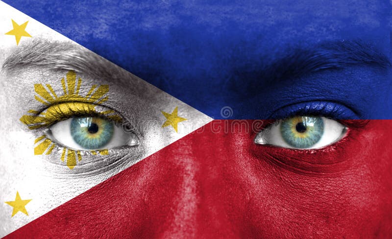 Rosto humano pintado com a bandeira de Filipinas foto de stock royalty free Rosto humano pintado com a bandeira de Filipinas foto de stock royalty free