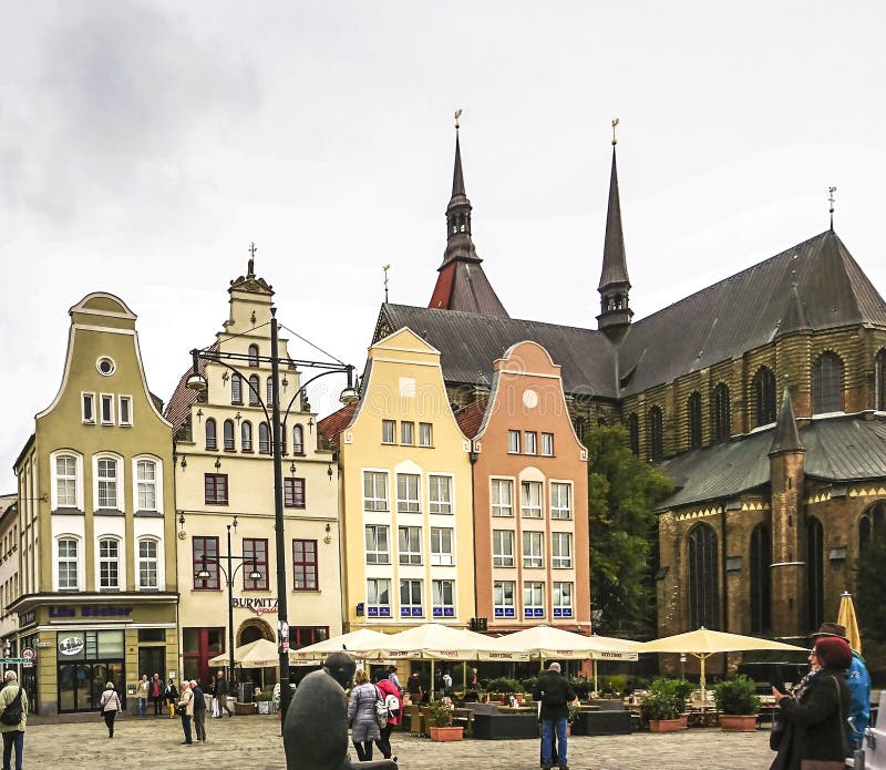 Rostock, Germany - September 23, 2018: A fragment of the church of St. Mary, beautiful buildings in the new market square. royalty free stock photos Rostock, Germany - September 23, 2018: A fragment of the church of St. Mary, beautiful buildings in the new market square. royalty free stock photos