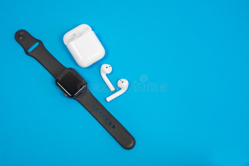 ROSTOV-ON-DON, RUSSIA - February 24, 2019: Apple Watch Series 4 and AirPods wireless Bluetooth headphones and charging case for Ap