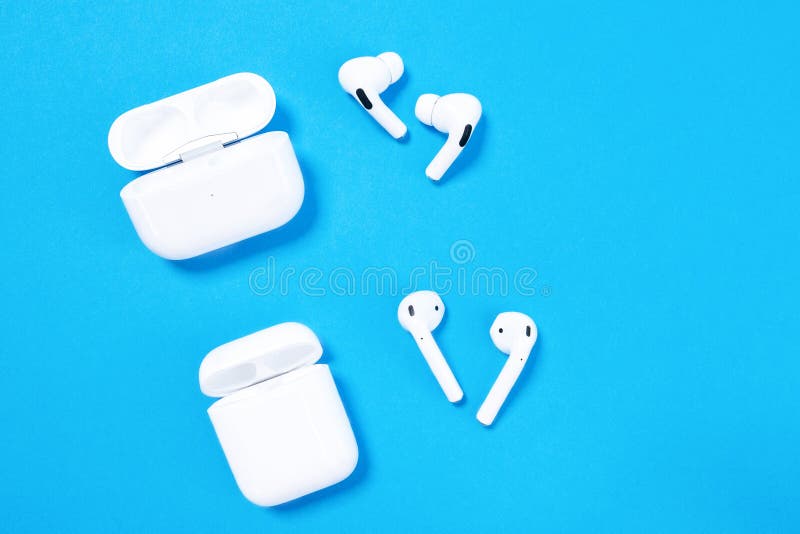 Rostov, Russia - July 06, 2020: Comparison of two generations of wireless headsets for Apple smartphones - AirPods and