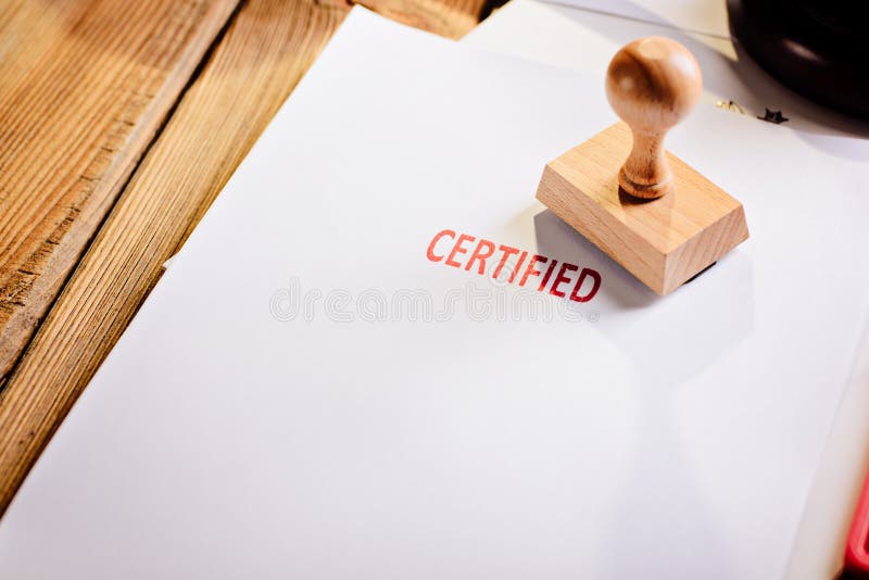 Red certified rubber stamp on white sheet of paper. Law office. Red certified rubber stamp on white sheet of paper. Law office.