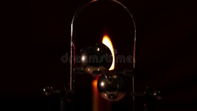 Rotating table pendulum balls antistress in the dark, for meditation, pendulum with rotating balls stock video