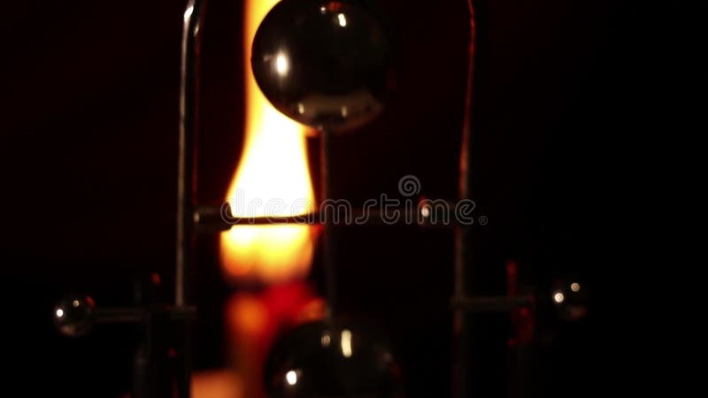 Rotating table pendulum balls antistress in the dark, for meditation, pendulum with rotating balls stock video