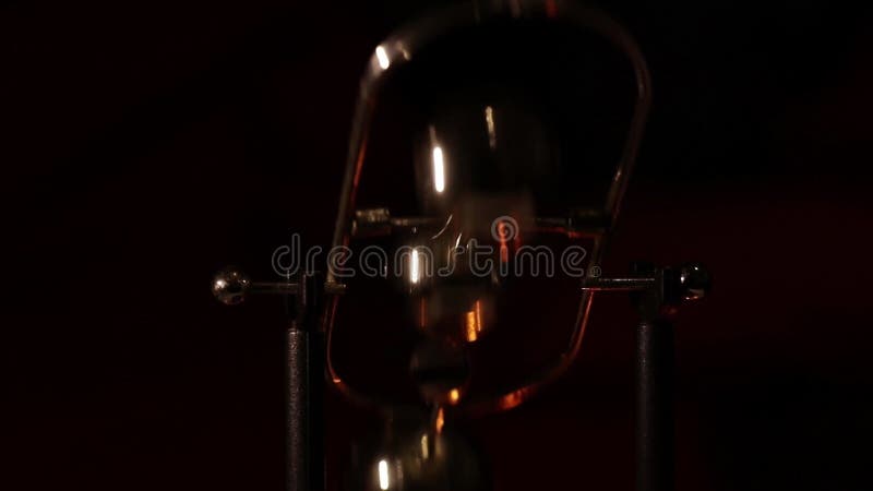 Rotating table pendulum balls antistress in the dark, for meditation, pendulum with rotating balls stock footage