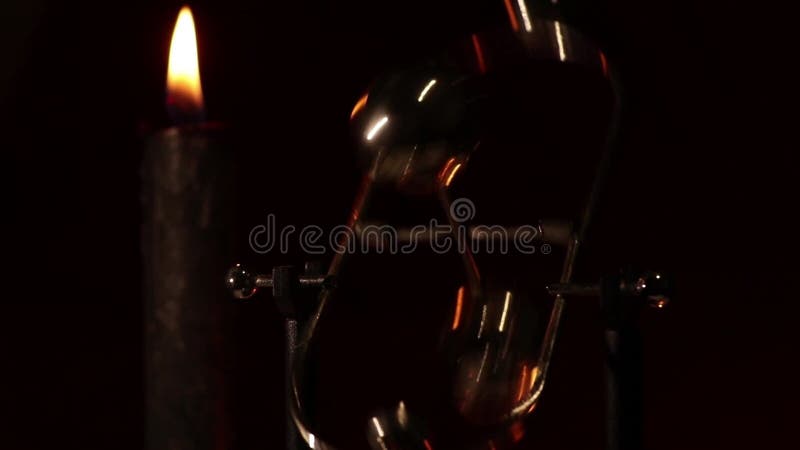 Rotating table pendulum balls antistress in the dark, for meditation, pendulum with rotating balls stock video footage