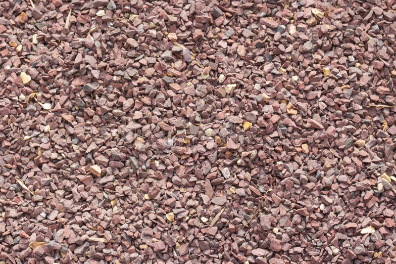 Rote Granitkrume, Hintergrund, Beschaffenheit, rote Burgunder-Steinkörnchen stockbild Rote Granitkrume, Hintergrund, Beschaffenheit, rote Burgunder-Steinkörnchen stockbild