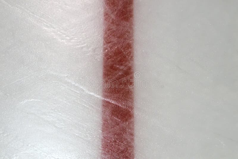 Ice hockey rink red markings closeup, winter sport background. Ice hockey rink red markings closeup, winter sport background.