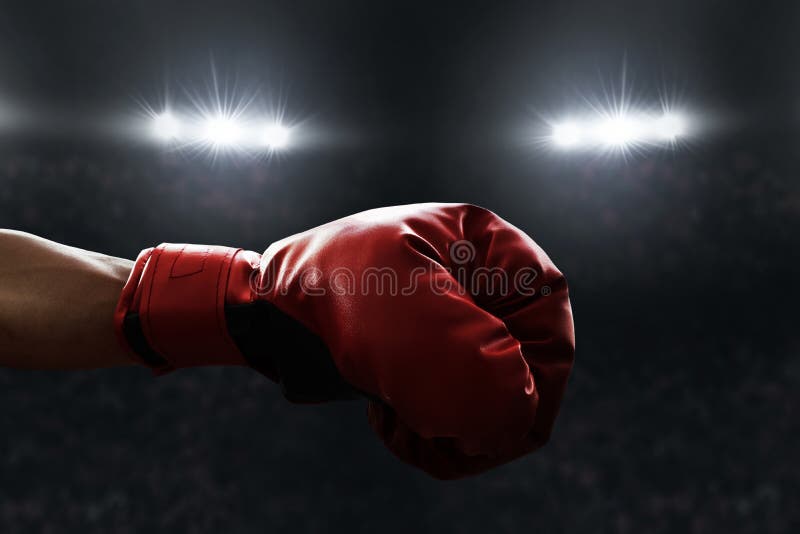 Roter Boxhandschuh auf den Ringen lizenzfreies stockbild Roter Boxhandschuh auf den Ringen lizenzfreies stockbild